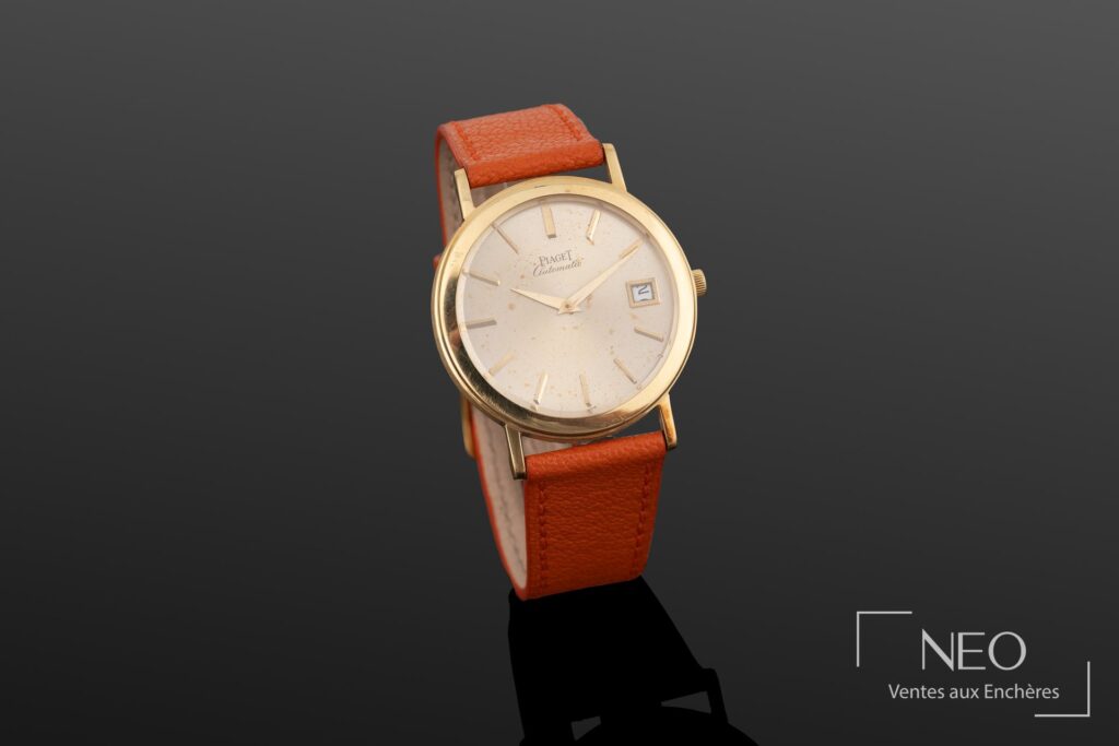 Montre Piaget Altiplano automatique en or jaune avec cadran doré et bracelet orange