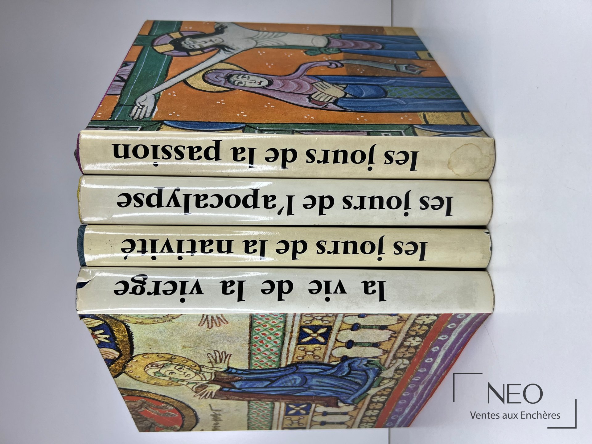 Quatre volumes reliés de Pierre Emmanuel avec couvertures illustrées et dos alignés