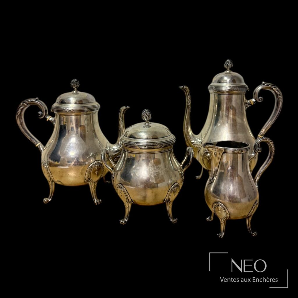 Service à thé et café Puiforcat composé de quatre pièces en argent et bois noirci