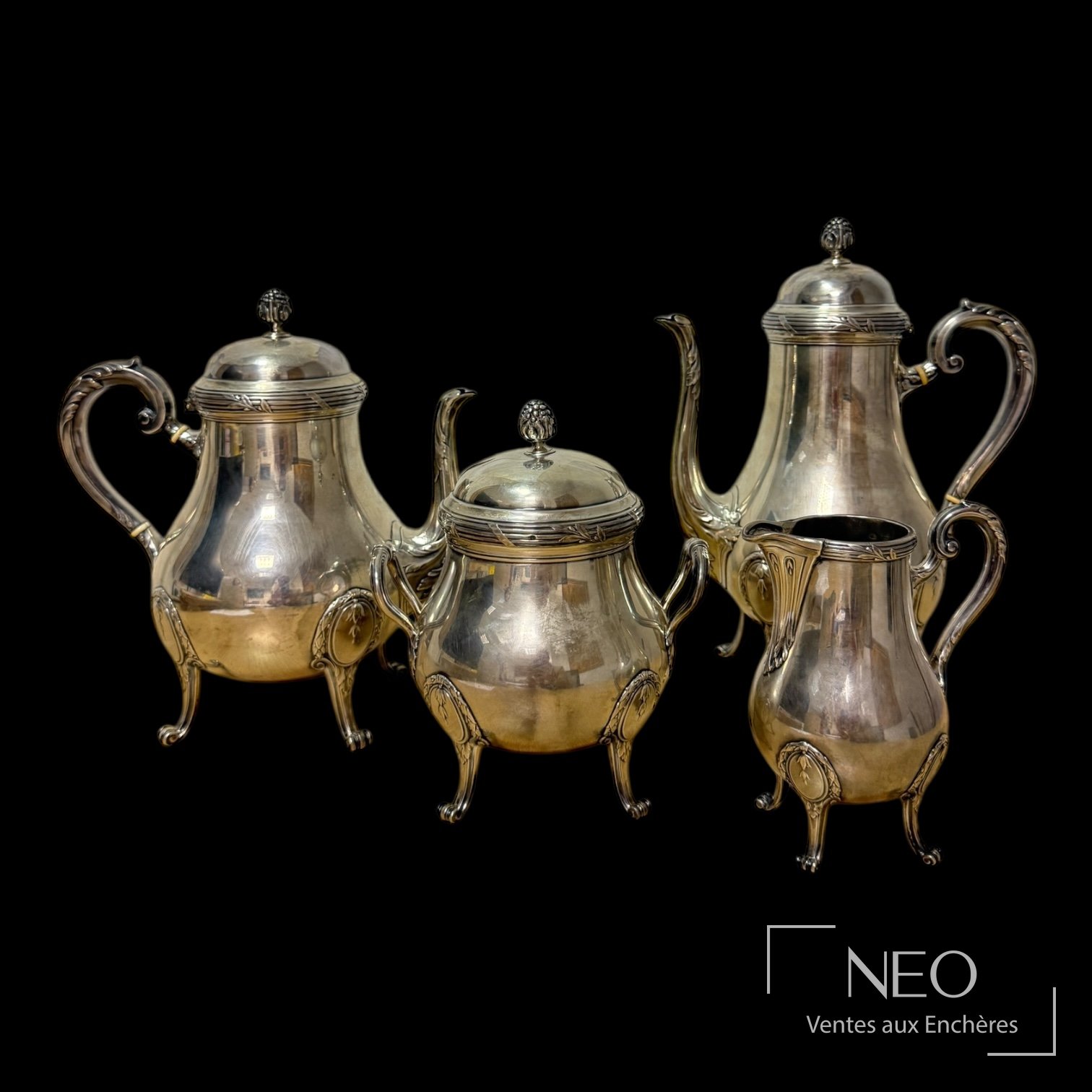 Service à thé et café Puiforcat composé de quatre pièces en argent et bois noirci