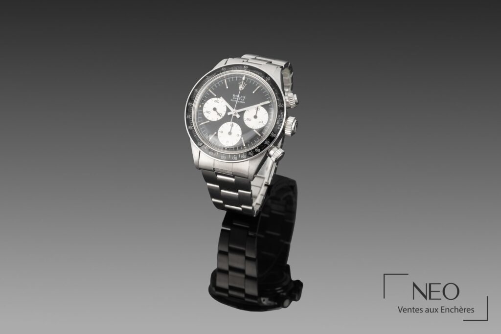 Montre Rolex Daytona Sigma en acier sur support