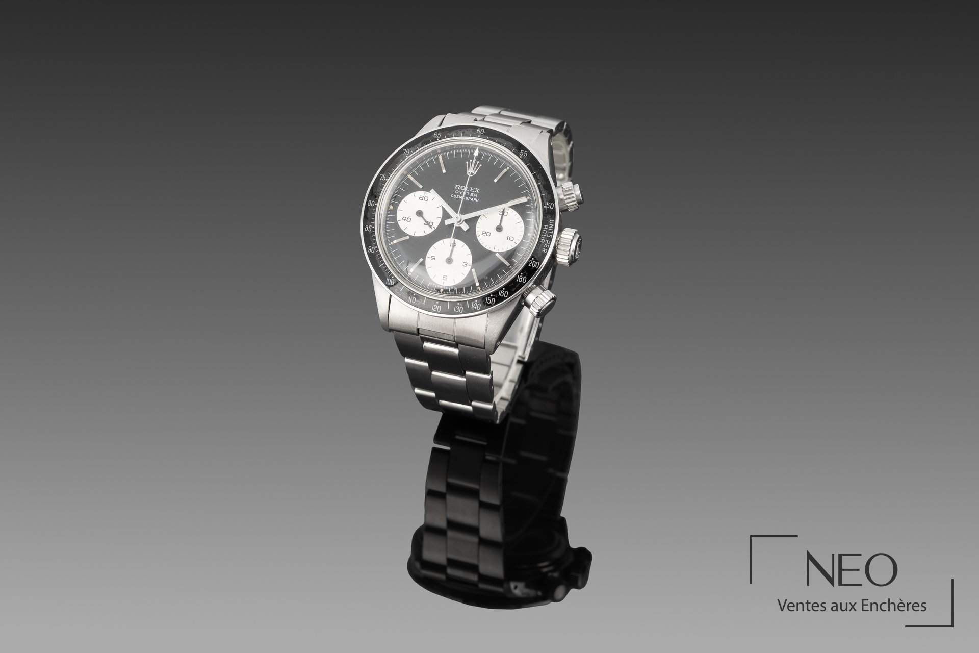 Montre Rolex Daytona Sigma en acier sur support