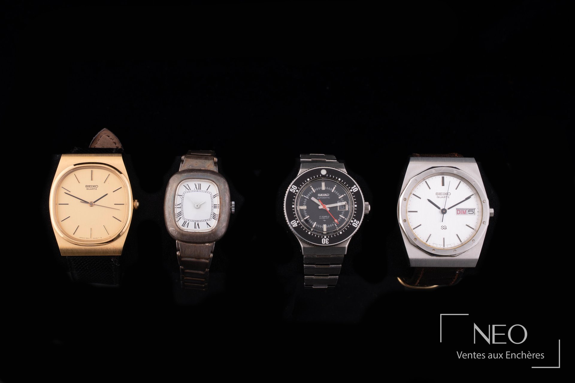 Lot de quatre montres Seiko et une montre de dame