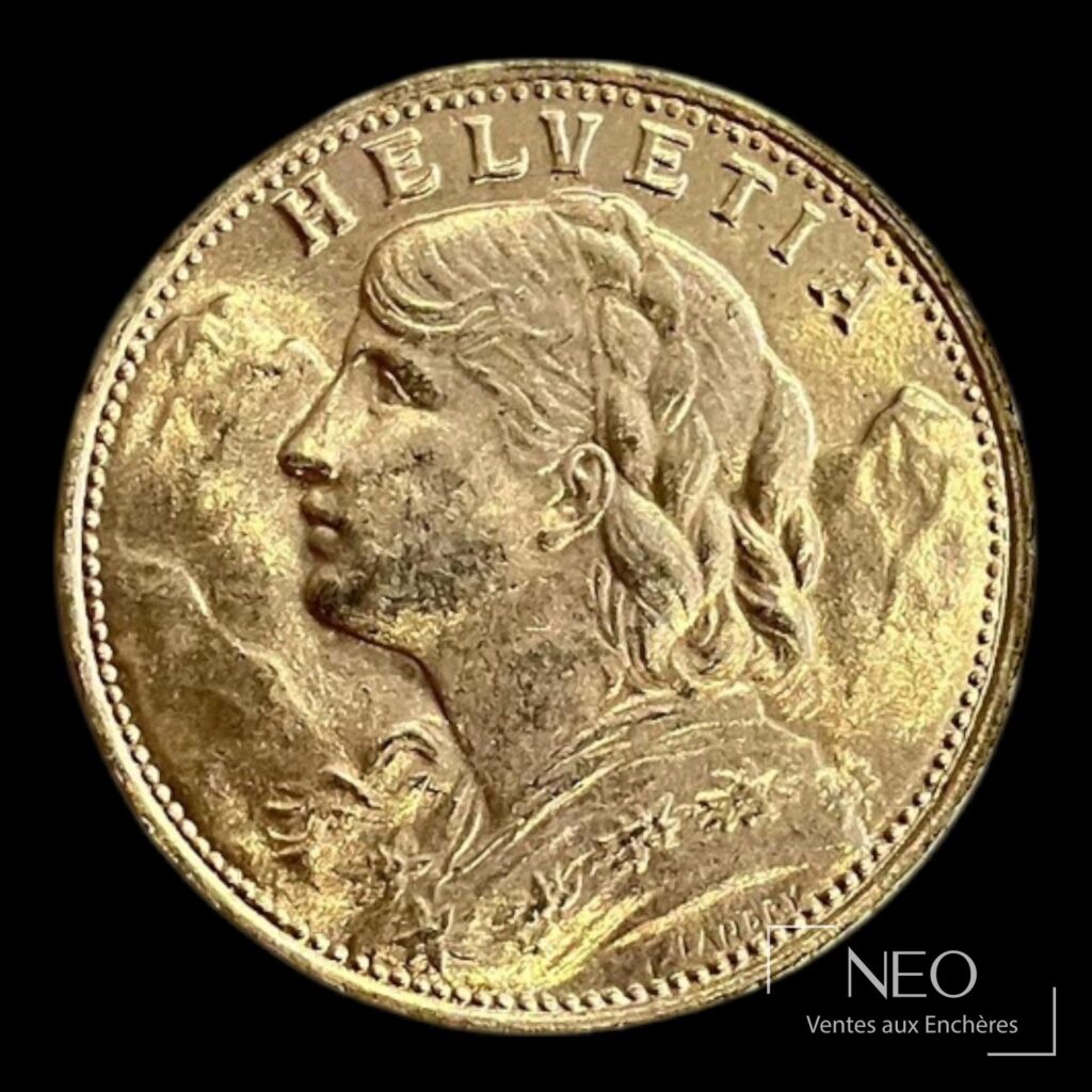 Avers d'une pièce suisse en or avec profil féminin et inscription HELVETIA.