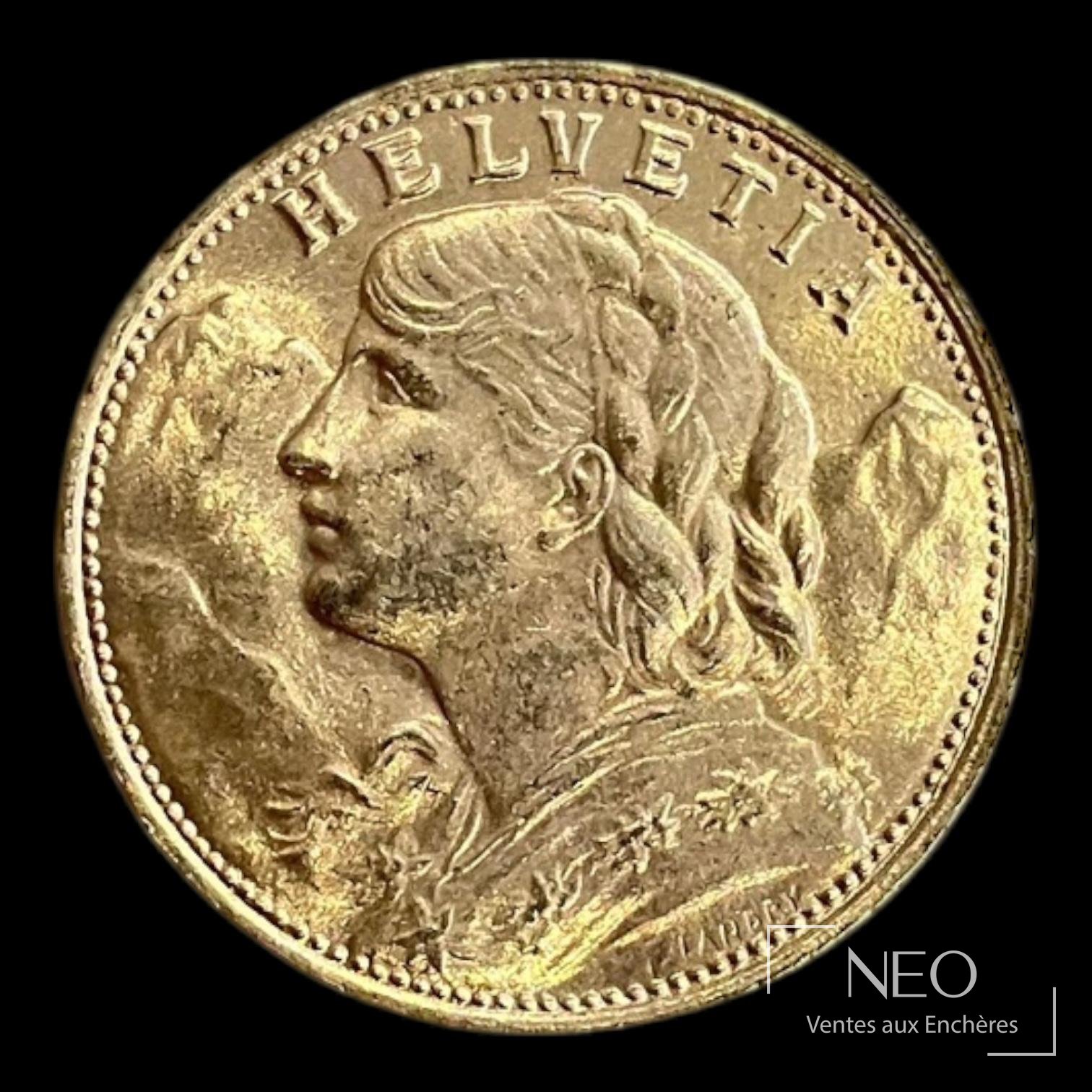 Avers d'une pièce suisse en or avec profil féminin et inscription HELVETIA.