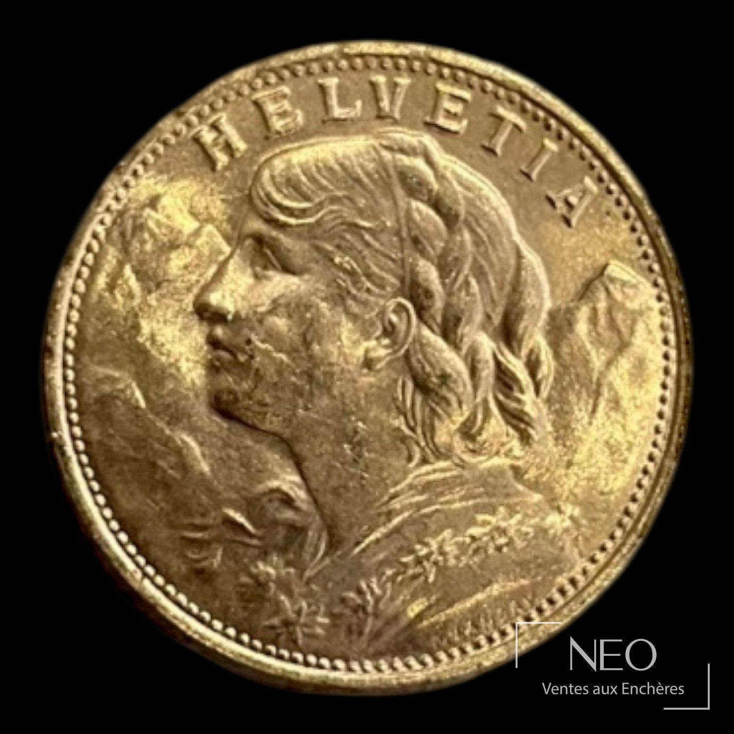 Avers d'une pièce suisse en or avec buste féminin de profil et inscription HELVETIA