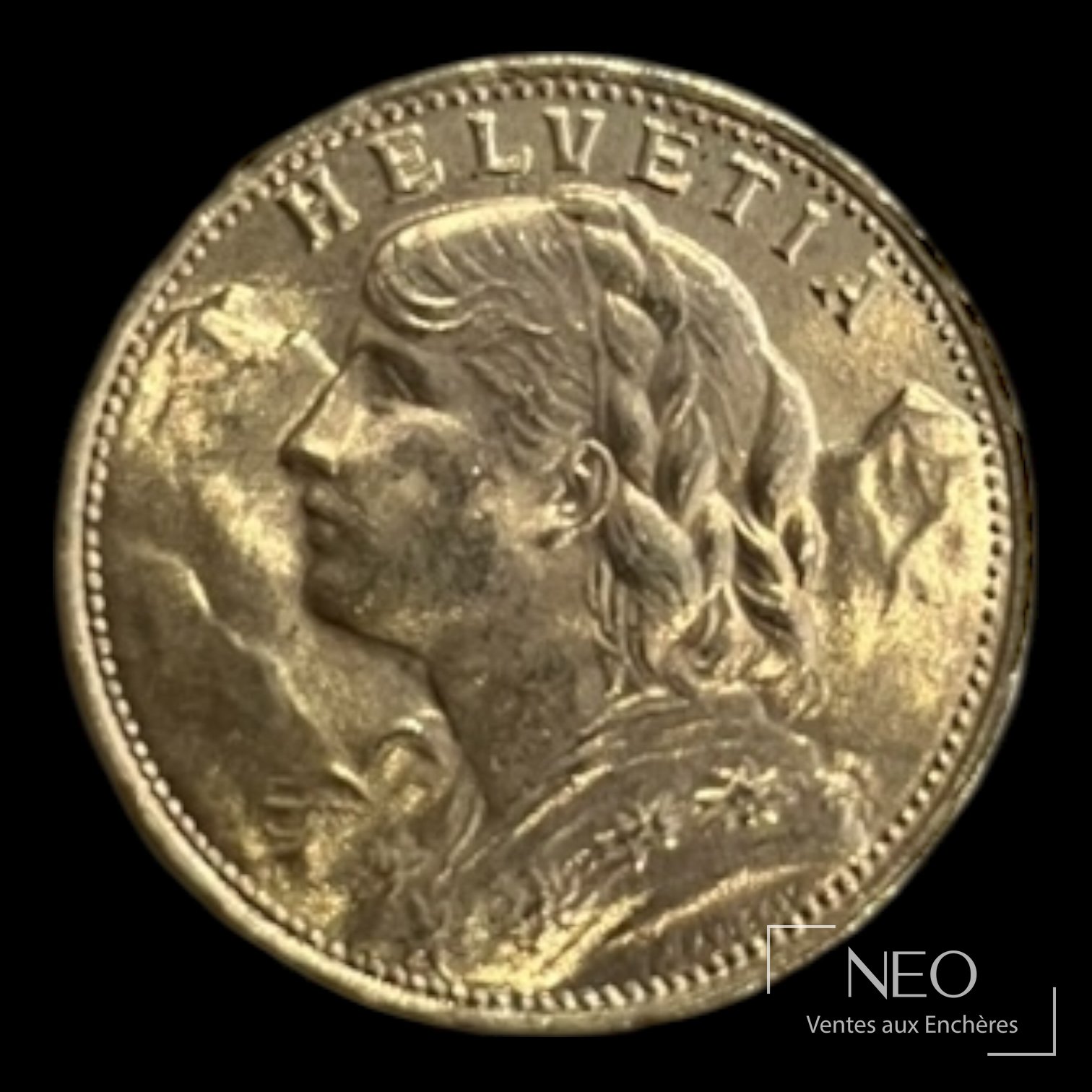 Avers d'une pièce suisse de 20 francs or avec le profil féminin et l'inscription HELVETIA.