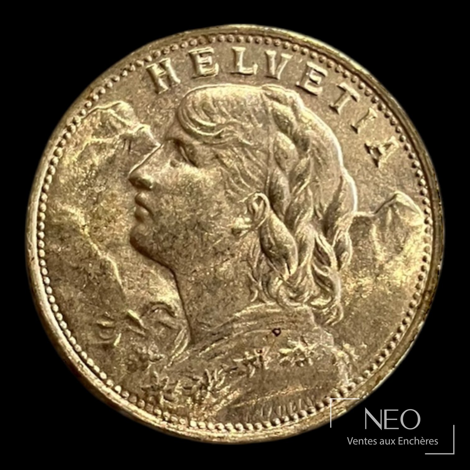 Avers d'une pièce suisse de 20 francs or avec profil féminin et inscription HELVETIA