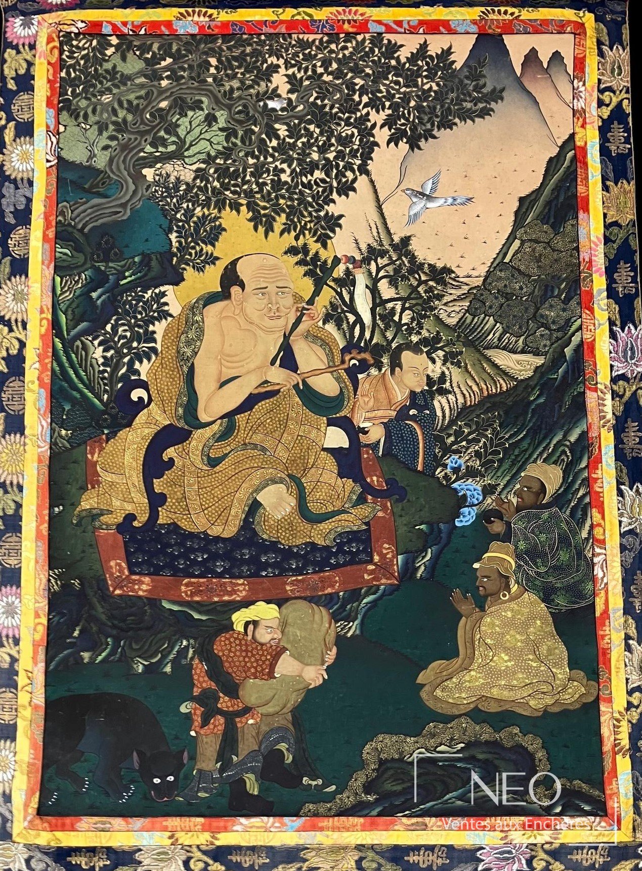 Thangka représentant l'arhat Angaja assis entouré de disciples et de deux adorateurs
