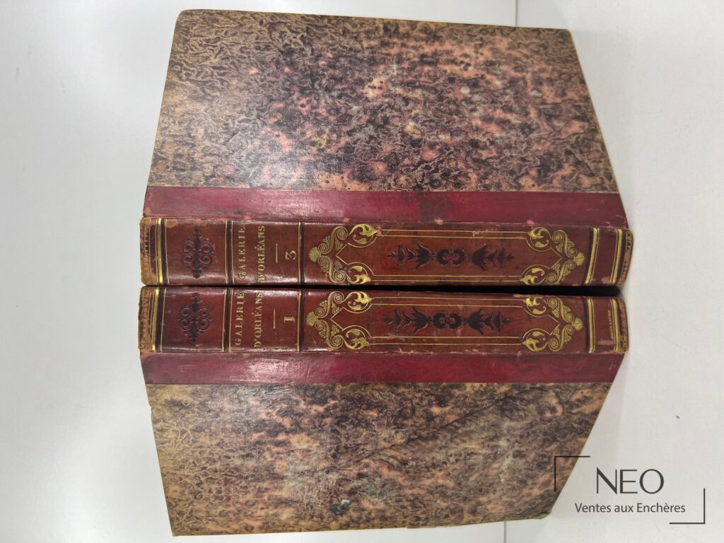 Deux volumes reliés en demi basane rouge avec plats marbrés et dos ornés de dorures.