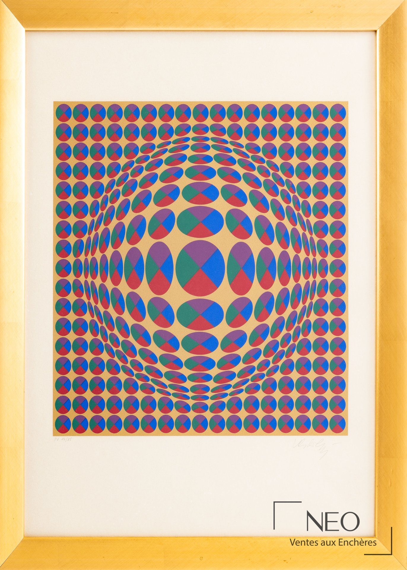Estampe en couleur de Victor Vasarely présentée sous verre dans un cadre doré.