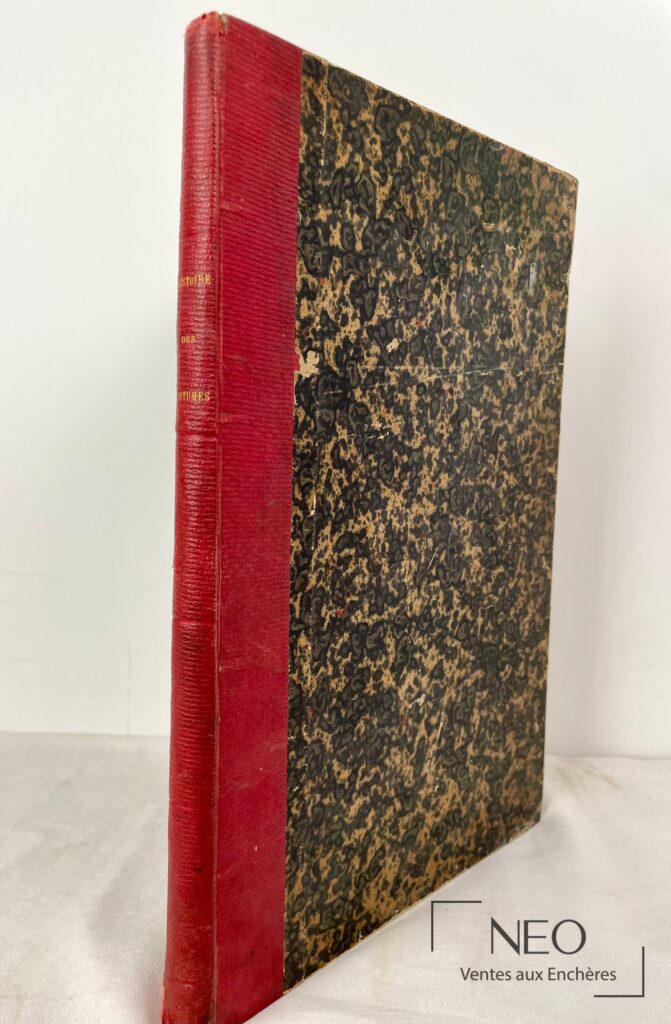Volume relié demi-toile rouge et plats marbrés