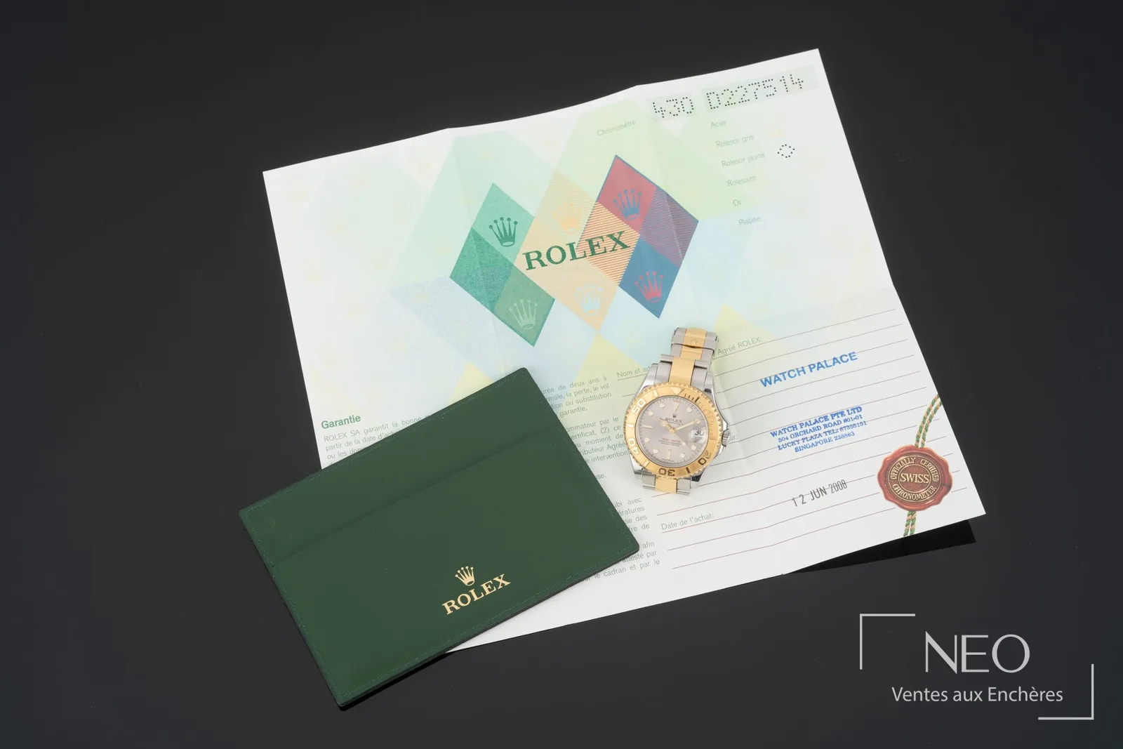 Certificat de garantie et porte-carte d’une montre Rolex Yacht-Master réf. 168623 en acier et or